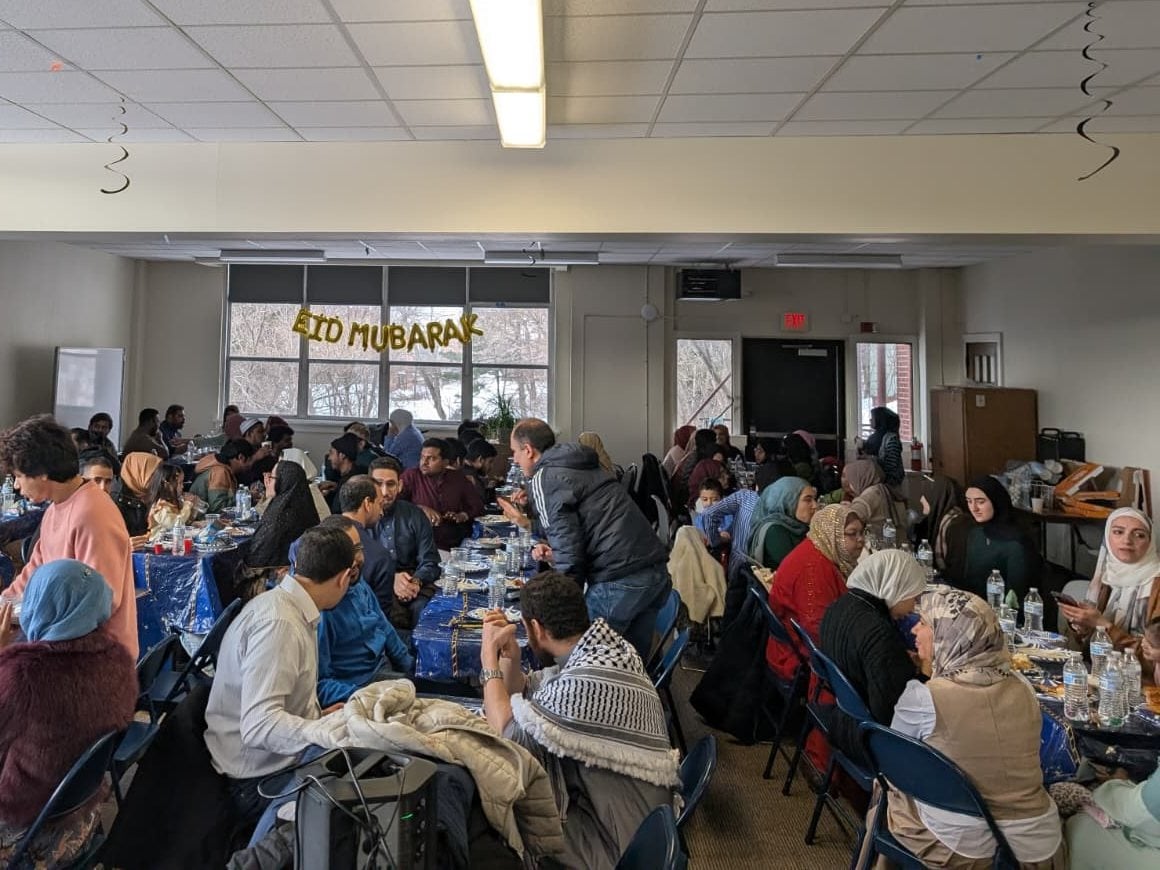 The MSA community celebrating Eid al-Fitr 2026 together at long tables under an Eid Mubarak banner